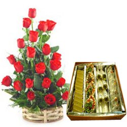 Enticing Assorted Sweets with Red Roses Basket Arrangement