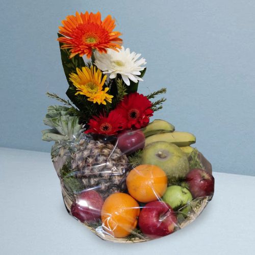 Delectable Fruit Basket with Floral Decoration