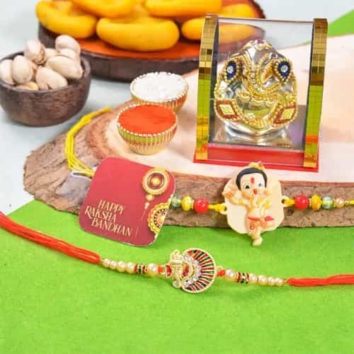 Divinity Pair Ganesh Rakhi and Delicacies