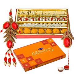 Fantastic Display of Assorted Sweets from Haldiram and Cadbury Celebration Chocolate Pack Bhaiya Bhabhi Rakhi Set and Kids Rakhi with free Roli Tilak and Chawal for this Raksha Bandhan